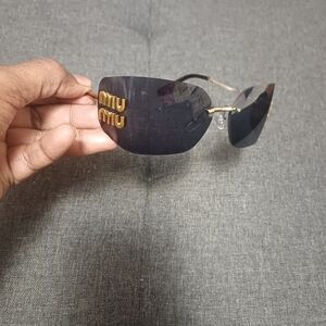 Miu Miu Black and Gold Sunglasses